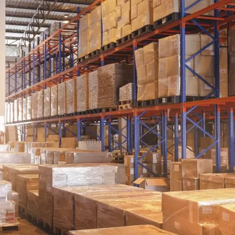 interior-storage-warehouse-with-package-boxes-tall-shelves