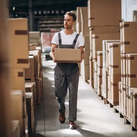 young-man-working-warehouse-with-boxes1