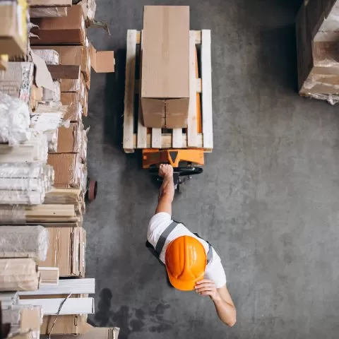 young-man-working-warehouse-with-boxes2